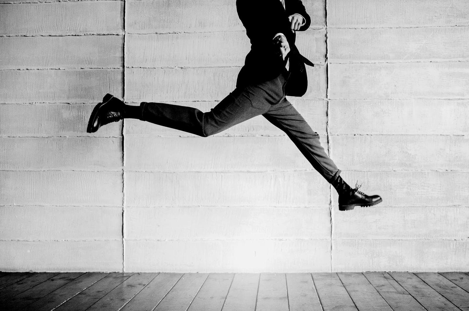 A person leaping across floorboards