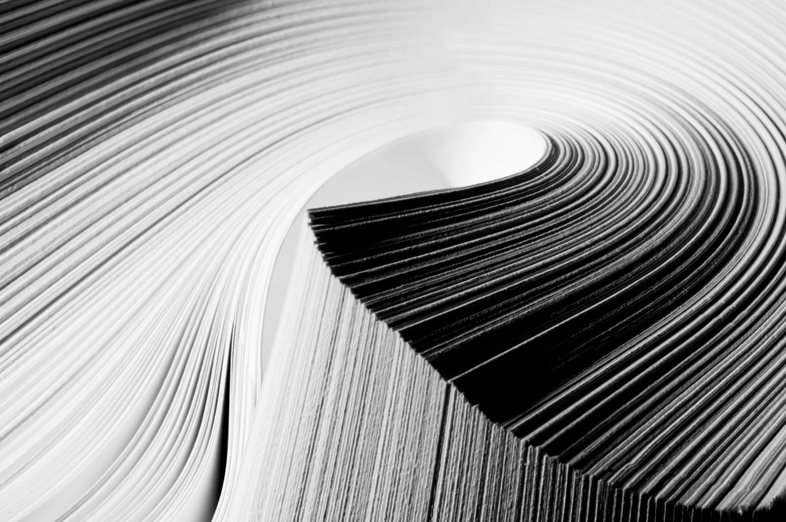 Close up of a stack of paper being folded