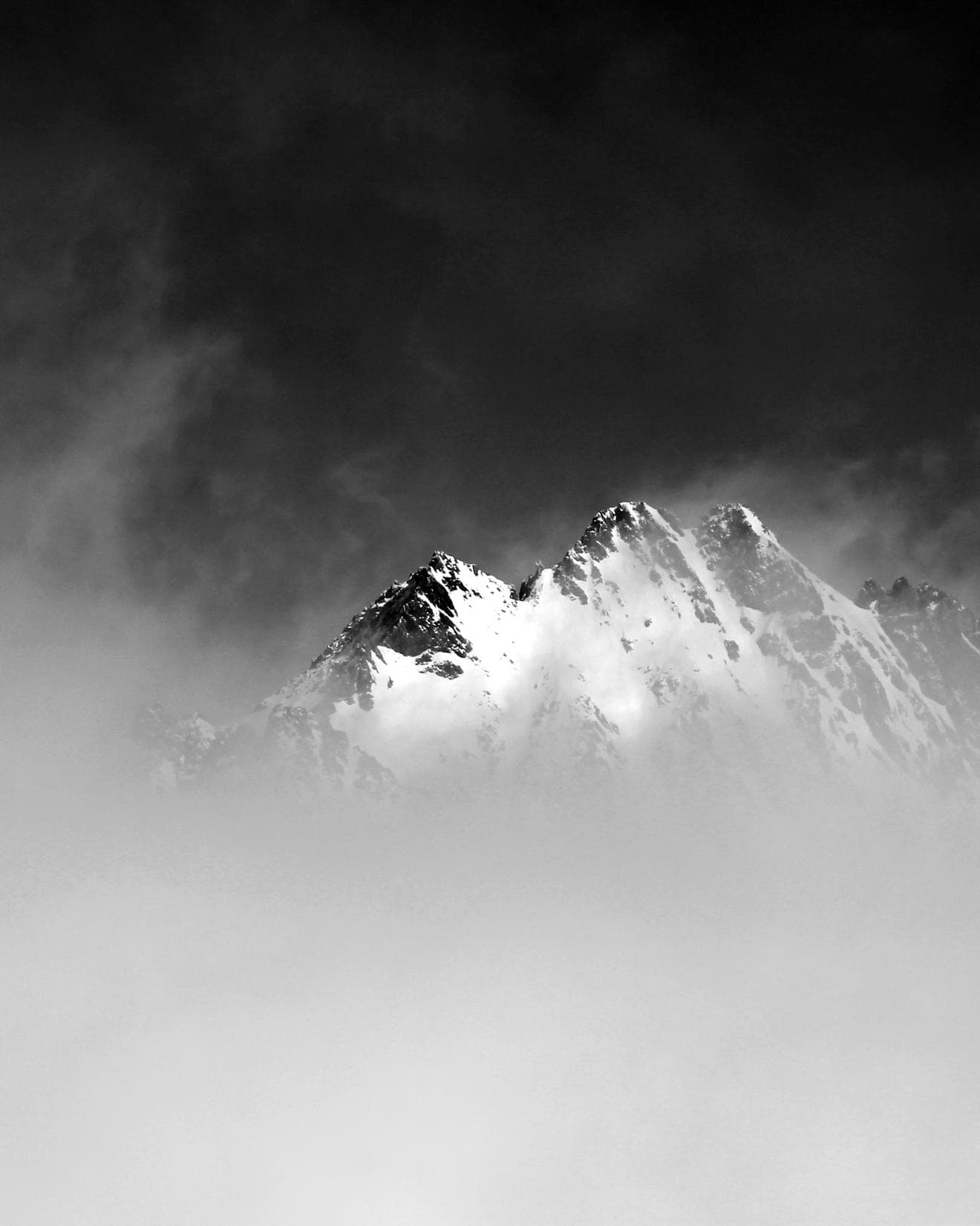View of snow covered mountains through the clouds in Slovakia