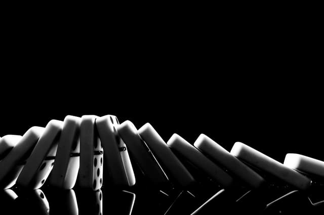 White dominoes on a dark background